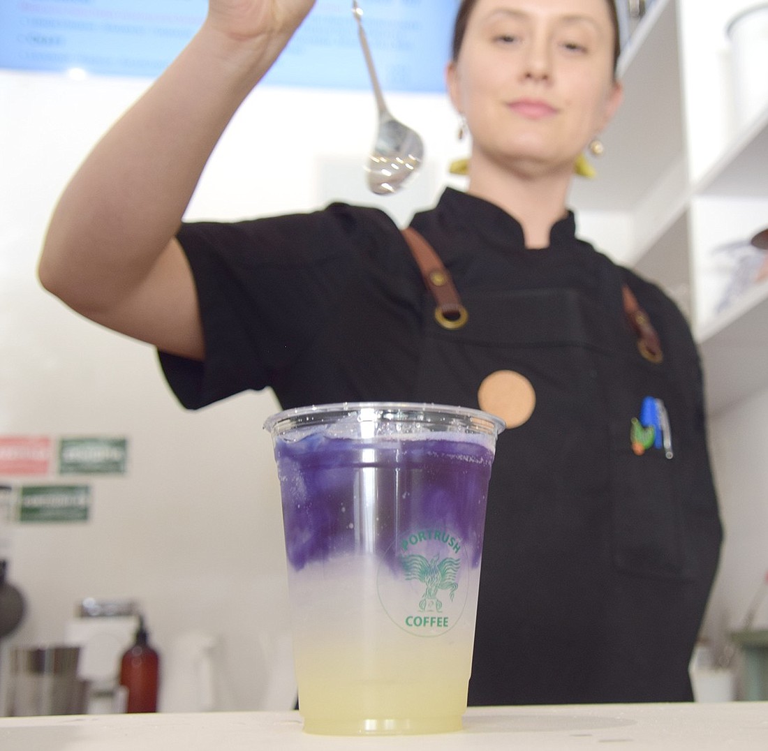 Abi Nares-Yanez prepares to mix a Butterfly Lemonade, one of the signature drinks at PortRush Coffee, on Friday, June 7. The newly opened café, which she helps run, strives to be a gateway into the world of specialty coffees for customers in Port Chester.
