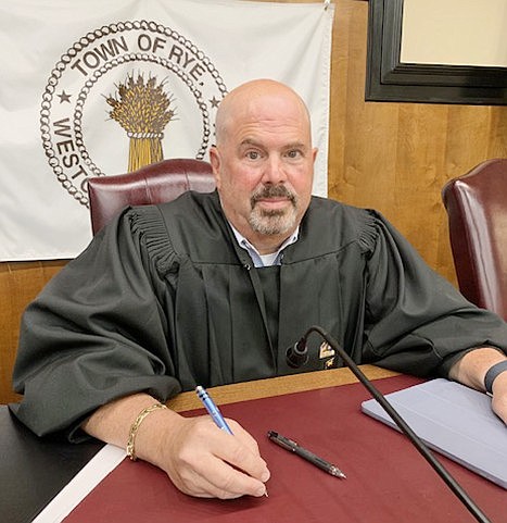 Judge Jeffrey Rednick at his chair in an empty Rye Town Courtroom on June 12.