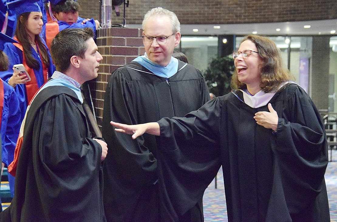 Administrators share a laugh before guiding the soon-to-be graduates to the stage. From the left: Director of Technology Charles Von Hollen, now retired Director of Pupil Services Harry Burg and Ridge Street School Principal Tracy Taylor.