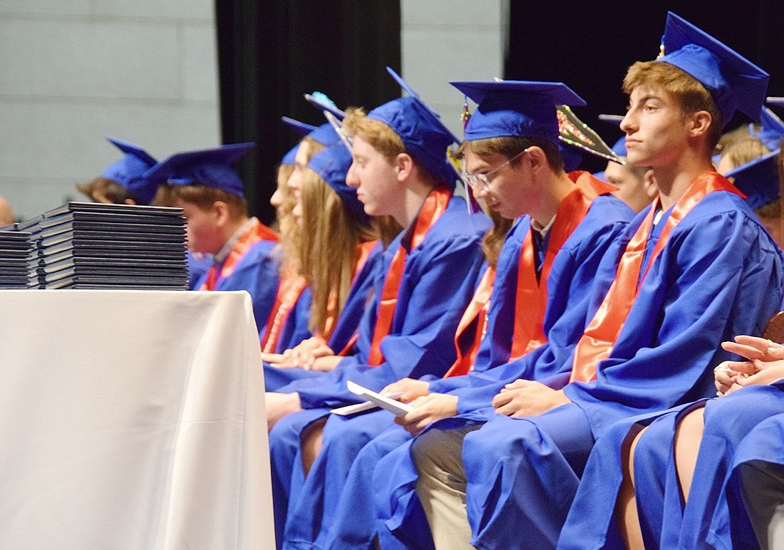 As speakers welcome friends and families to the 2024 Blind Brook High School commencement on June 20, soon-to-be graduates including Michael Berman Annunziata (right) and Alex Berk look toward the massive crowd.