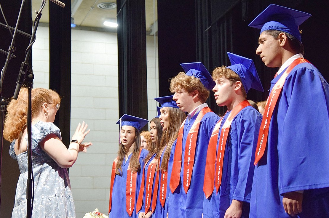 Jessica Cerasoli conducts her choir students for the last time as they sing “Home” by Phillip Phillips. The graduates, from the left, are: Cassidy Wohl, Zoeya Suhail, Toby Grossberg, Hunter Greenspan, Daniel Greenspan and Devin Dayal.