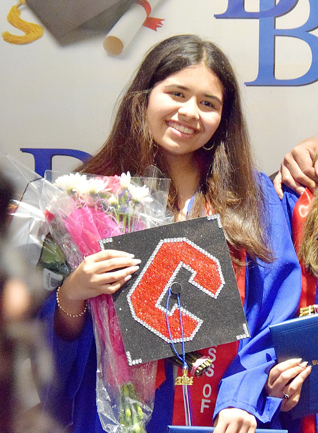 As a proud Blind Brook High School graduate, Zoeya Suhail smiles widely as she poses for a photo after commencement on June 20. A top scholar of the Class of 2024, she’s headed to Cornell University in the fall to study computer science.