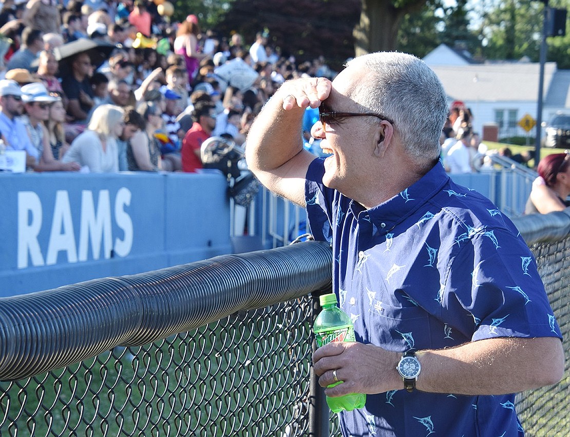 Momentarily returning to Port Chester High School, retired Assistant Principal Fortunato DiRenno makes an appearance to support his former students and say “hi” to families.