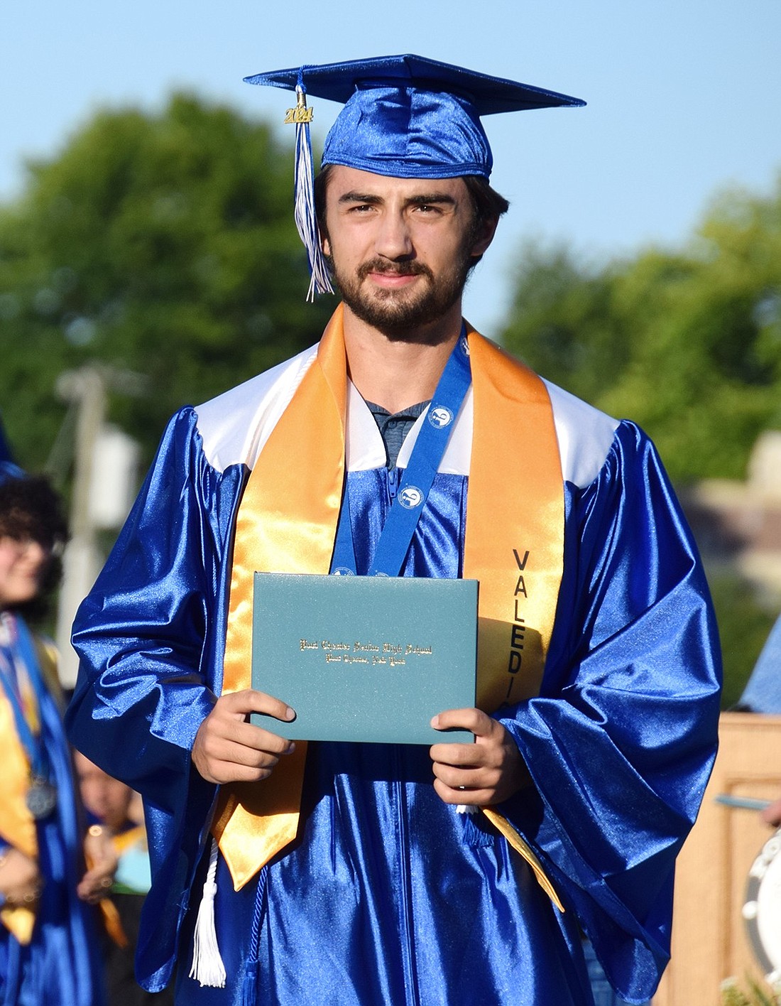 Port Chester High School valedictorian Orhan Eski walks after receiving his diploma during the Class of 2024 commencement on Thursday, June 27. Eski will be attending Duke University in South Carolina to study electrical and computer engineering.