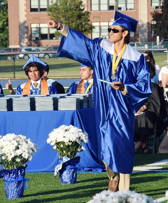 Jonathan DelCid points to loved ones as he struts down the aisle.