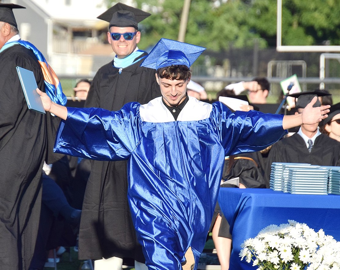 Anthony Escobedo has clear pride, and gratitude. After his name is called, he goes out of his way to shake the hand of Principal Luke Sotherden, who proudly watches as the former student walks down the aisle.