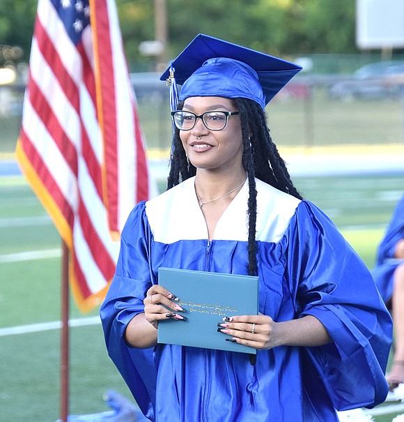 Yanisa Manderson illuminates hope and sincerity, marching towards the future with her graduation credentials.