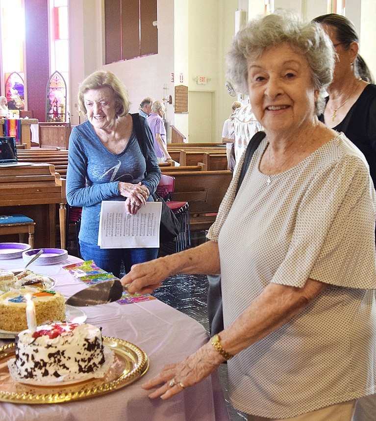 Heather Paul cuts the birthday cake the St. Paul’s Church congregation surprised her with after their service Sunday morning, June 30. The longtime Port Chester resident turns 98 on July 6.