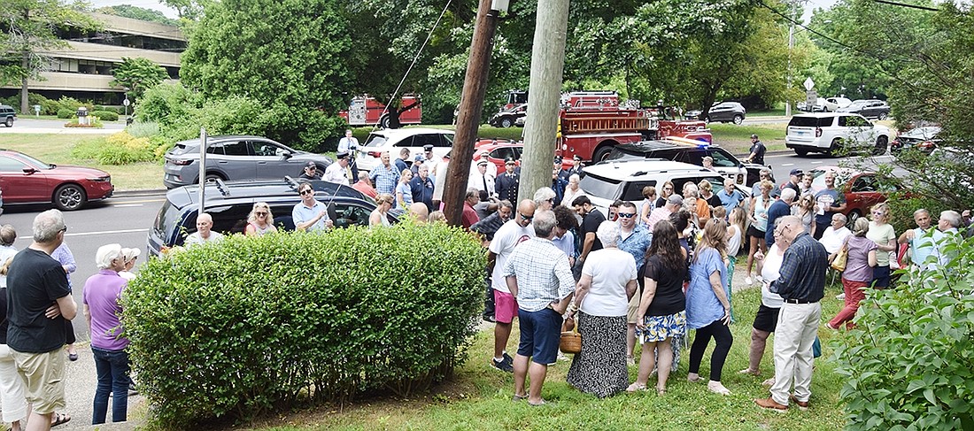 The crowd that gathered and spilled into the street just over the state line in Greenwich, Conn. for a 50-year commemoration of the Gulliver’s nightclub fire on Sunday, June 30. The office building that sits on the property where Gulliver’s stood can be seen in the background.