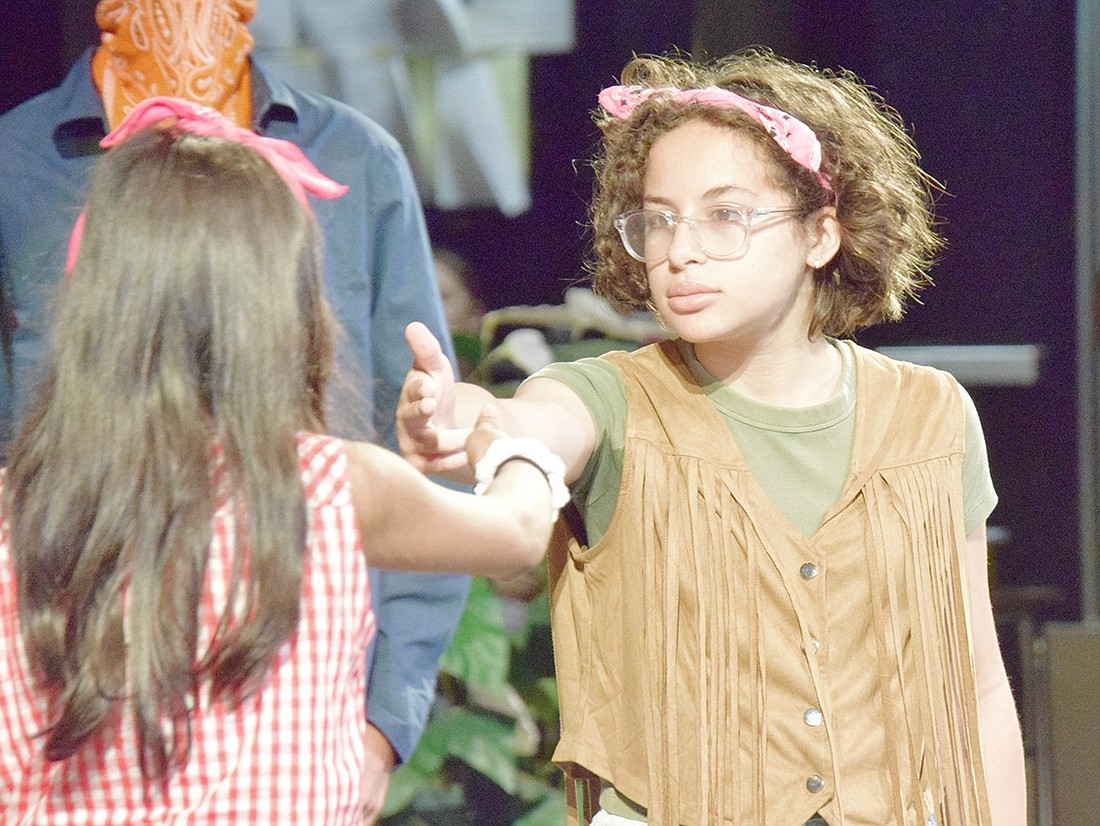 Portraying Helena, Samantha Geller (right) acts out a scene from William Shakespeare’s “A Midsummer Night’s Dream,” with a Wild West twist. The entire Blind Brook Middle School seventh-grade class spent the last unit of the year studying the playwright’s work, which culminated in a performance on June 21.