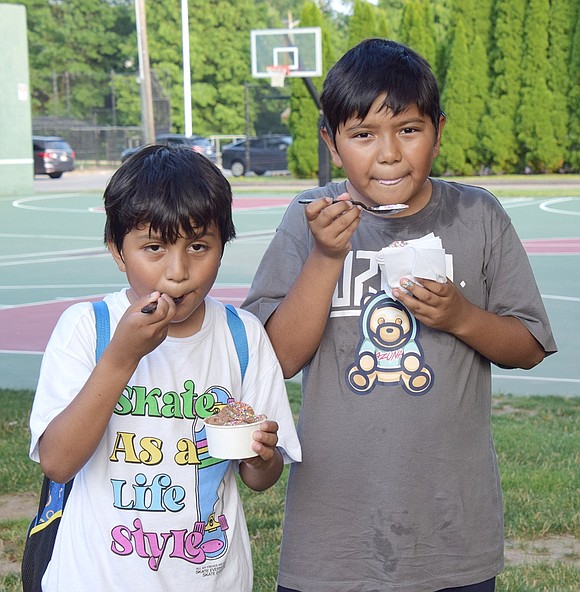 After working up a sweat playing in the park, Port Chester brothers Martin, 8, and Emanuel Perea, 10, cool off with their frozen delights.