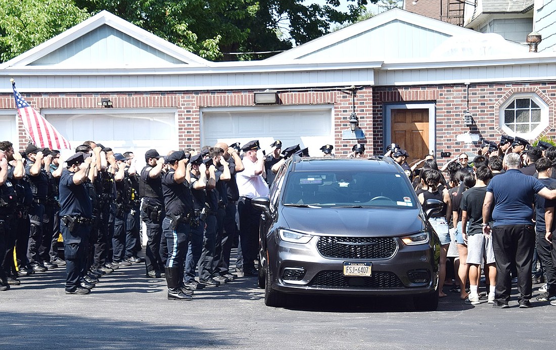 Around 50 law enforcement officials from across the region join the family and friends of Christopher Bernal, a Port Chester police officer and lifelong Village resident who died on Sunday, July 7, at the Craft Memorial Home on Leicester Street on July 9. Saluting in a final farewell, multiple agencies had just escorted Bernal’s remains back home from Goshen in a procession organized by the Port Chester police.