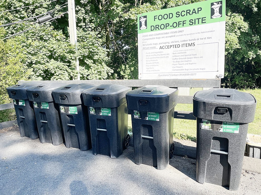 The brand new Toter food scrap receptacles at the far end of the parking lot at Rye Brook Village Hall are more secure than the old ones, keeping out raccoons and presenting a neater image. To open the top to drop in your biodegradable food scrap bags, you must squeeze together the opener on the front of the container and then lift the top with the handle. It’s important to close it back up afterwards (it locks automatically) to make sure no critters can get inside. Through a joint food scrap recycling agreement, these receptacles are available for both Rye Brook and Port Chester residents to use.