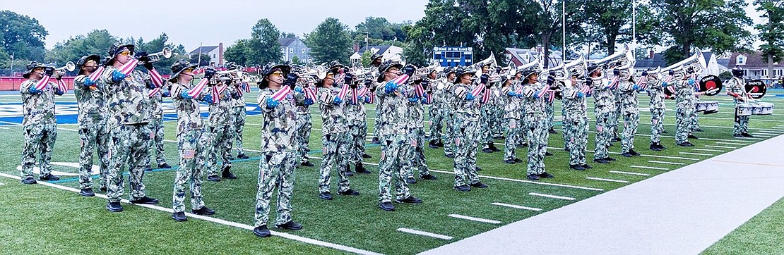 The Port Chester-based Saints Brigade Drum & Bugle Corps takes the field to entertain the crowd in their military fatigue uniforms.