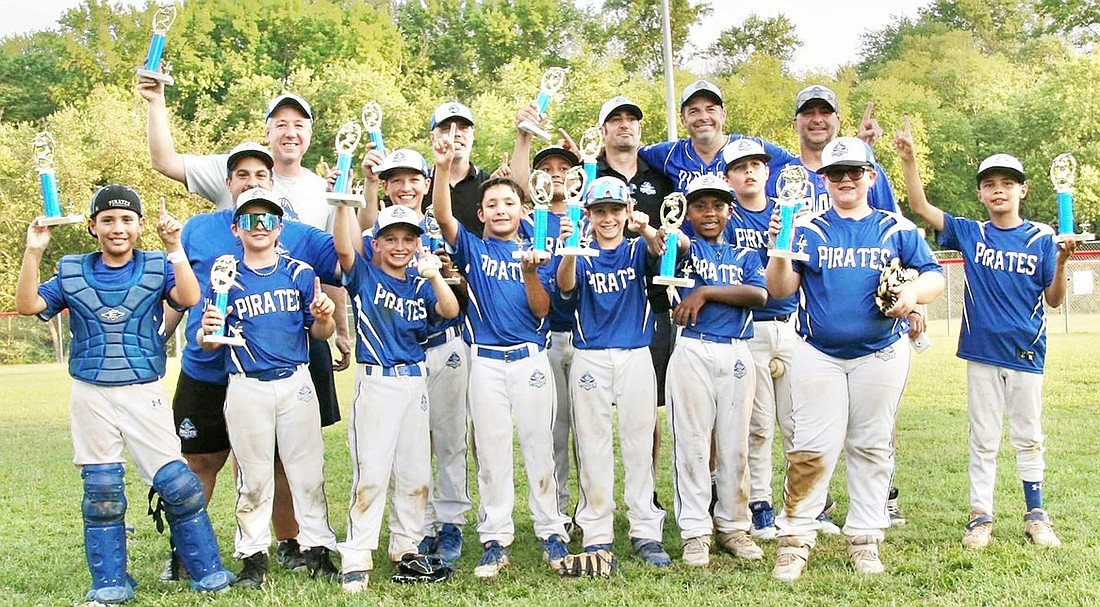 The 10U Pirates with their first place trophies for winning the Sacred Heart Slugfest in Hainesport, N.J., last weekend in their age group. Front row, from left: LJ Sherwood, Derek Lovallo, Luke Petriello, Robert Berlingo, Noah Klauck, Gabrielle Rieke, Kyle Renaldo, Daniel Sherwood. Middle row, from left: Coach John Renaldo, Nolan Brown, Dylan Rivera, Myles DeBari. Back row, from left: Head Coach Jeremy Brown, Coaches Jim Sherwood, Rich Berlingo, Dan DeBari, Jon Lovallo.