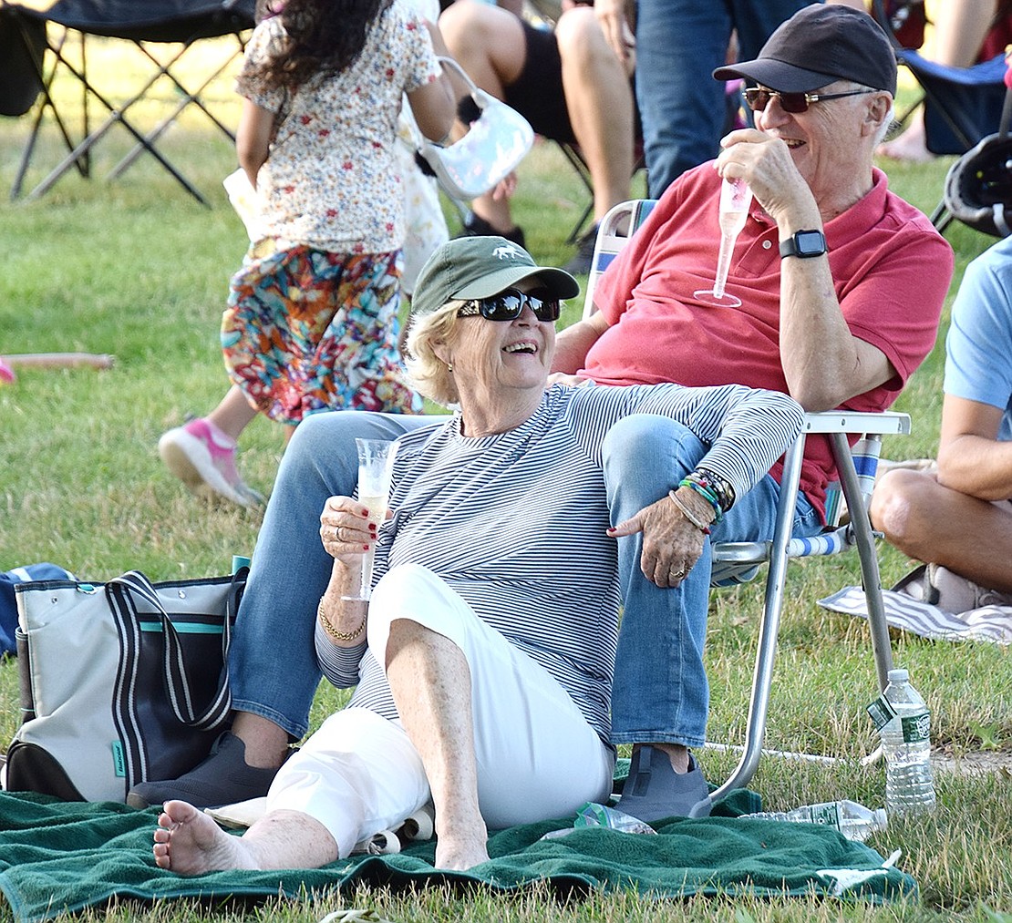 As the evening goes on and the weather gets cooler, High Point Circle residents Barbara Eckel and Reimer Loessner embrace the ambiance of the summer day while enjoying each other’s company.