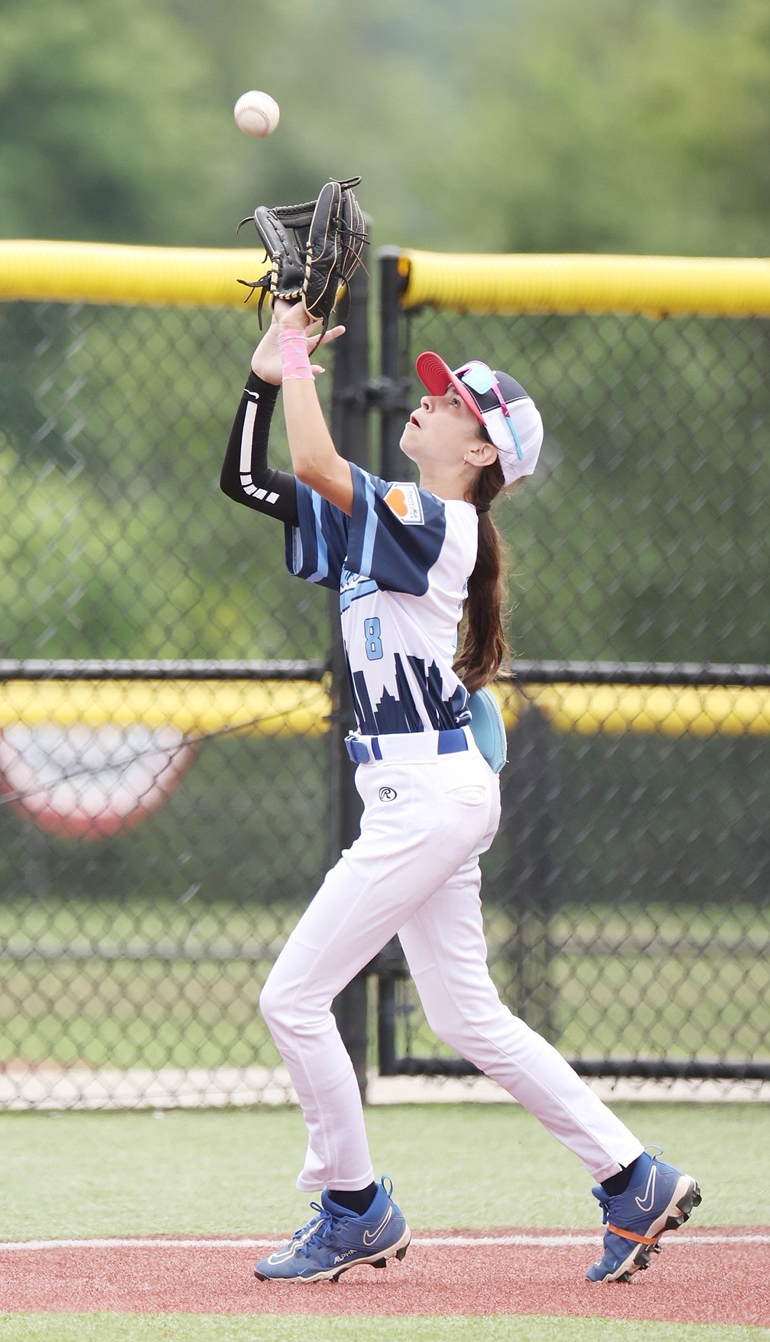 Port Chester’s Sophia Faraci makes a sensational catch during the “Baseball for All” national tournament at the Elizabethtown Sports Park in Elizabethtown, Ky., on July 7. It is the biggest girls’ baseball tourney in the U.S.