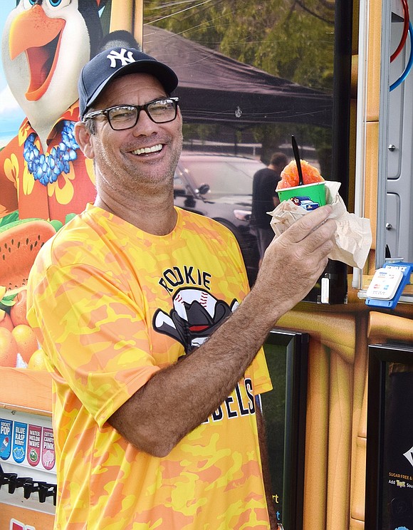 “It’s not for me,” laughs Cameron Wallace, a Crossway resident, after buying a frozen treat from the Kona Ice food truck at the festival.