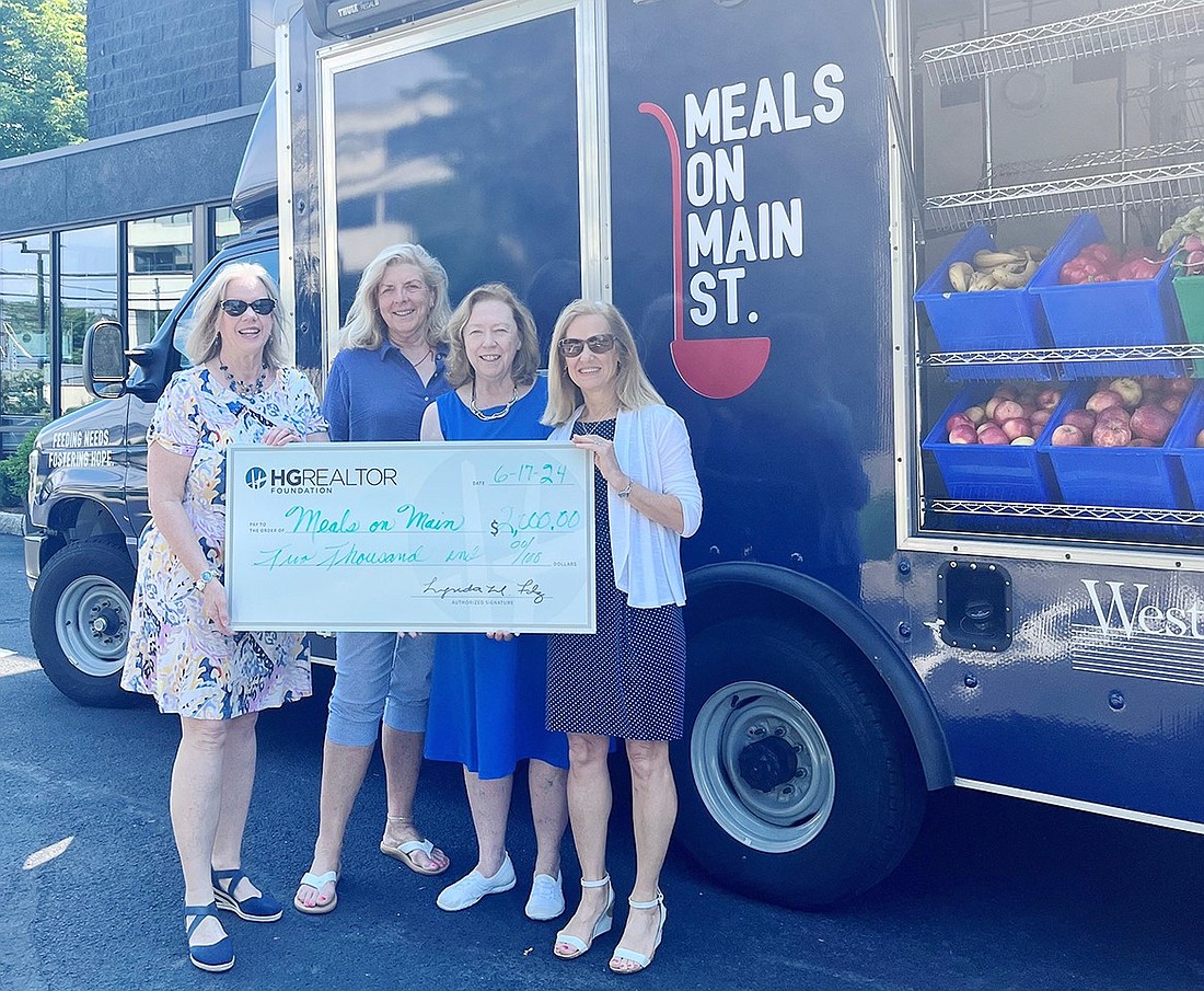 Replica of the check presented to Meals on Main Street by the Hudson Gateway Realtor Foundation. From left, Mary Prenon, HG Realtor Foundation; Denise Cyper and Pat Hart, Meals on Main Street; and Gail Fattizzi, HG Realtor Foundation.