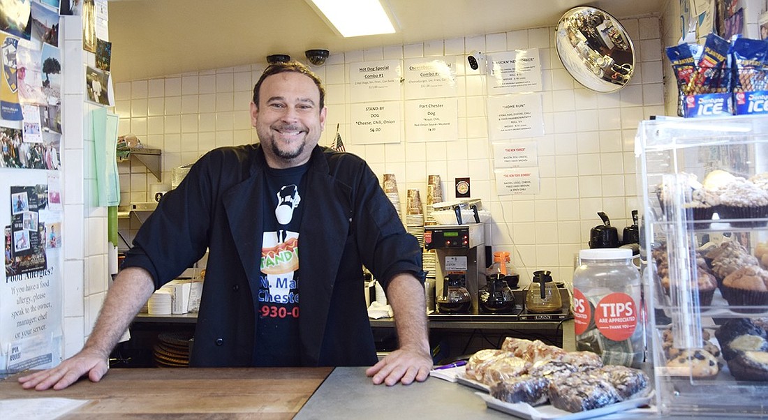 Port Chester native Kevin Allmashy poses for a picture behind the counter of Stand By on Friday, July 26. After 18 years of owning a deli in Greenwich, Conn., he’s taken over the restaurant at 604 N. Main St. to bring his culinary experience to the Village.