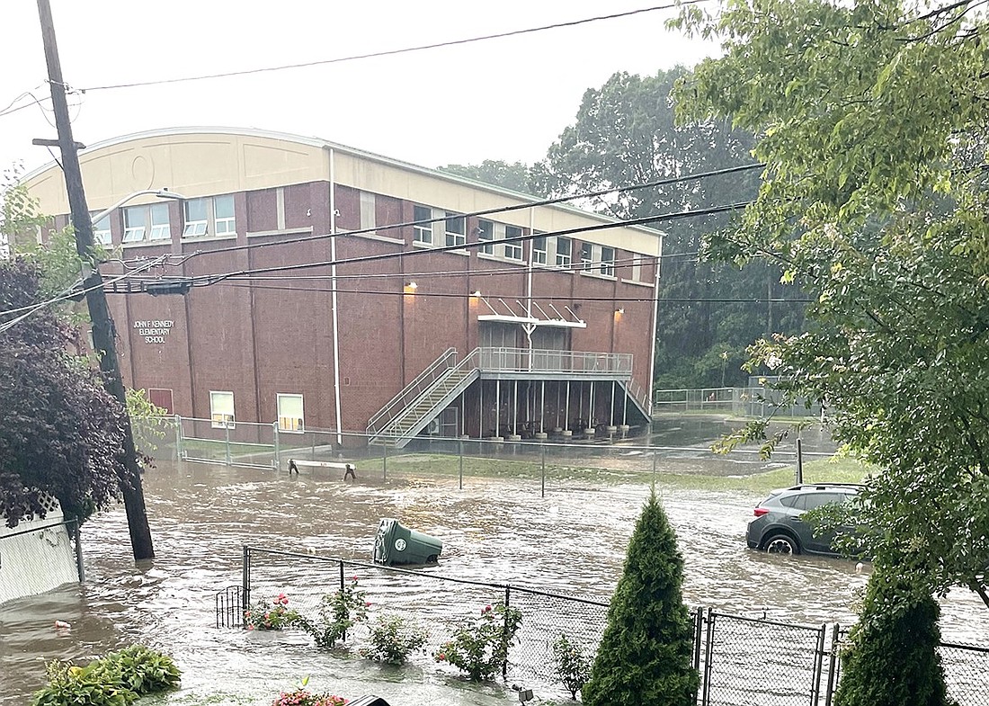 A garbage bin floats away down Olivia Street during a heavy rainstorm in July 2023 which caused severe flooding in Port Chester. The Village has spent the last year improving the stormwater system, including a mitigation project that just concluded around Olivia Street.