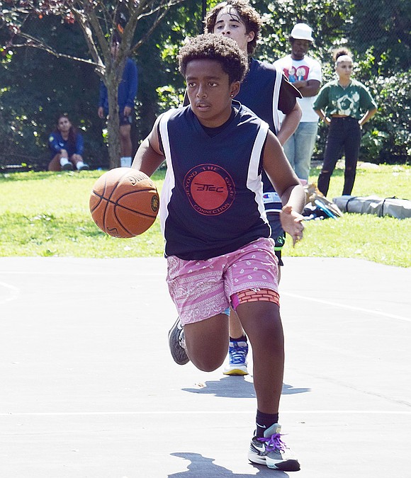 Playing for Beyond the Game Connection, Bentley Davis, a rising freshman who lives in Port Chester, drives the ball down the court during a match against Greenburgh players.