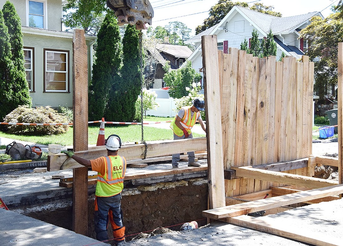 Village of Port Chester contractors work towards repairing a section of the Bulkley Drain that runs along North Regent Street on Tuesday, Aug. 13. Damage to the stormwater system was discovered after heavy rain poured on the area on Aug. 6.