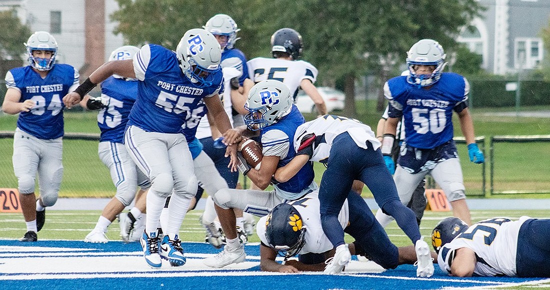 Quarterback Alexis Morel (with ball), a rising junior, will be part of the Port Chester Rams’ offensive one-two punch during the upcoming football season.