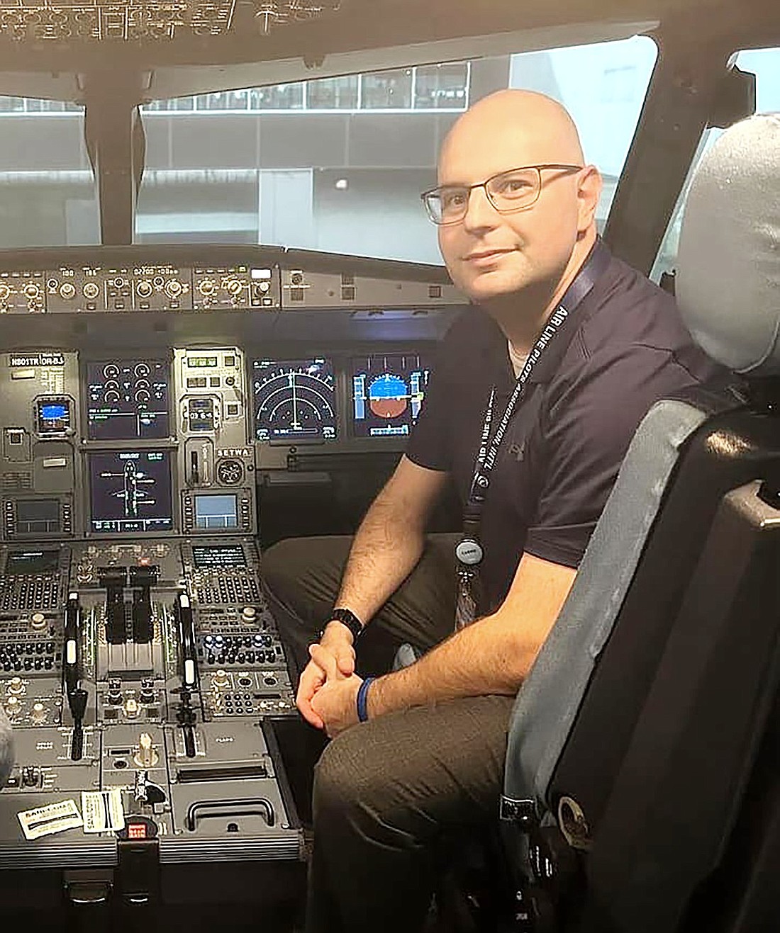 Jason Kaye, a Rye Brook native who now works as a pilot for a major airline, poses for a picture while in a flight simulator. The 31-year-old has created a Facebook group to help the next generation of pilots work their way into cockpits.