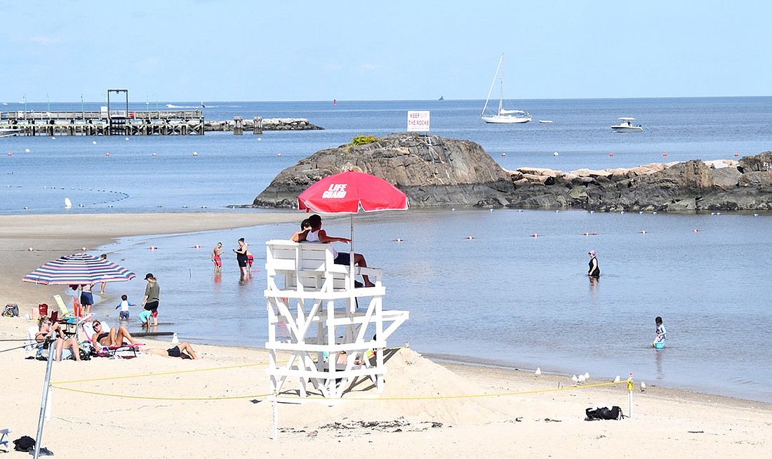 Beachgoers start wading in the water shortly after a no-swimming ban was lifted from the beach at Rye Town Park on Aug. 13. The Westchester Department of Health closed the beach for a few days due to elevated bacteria levels, a phenomenon becoming more common due to frequent heavy rainstorms.