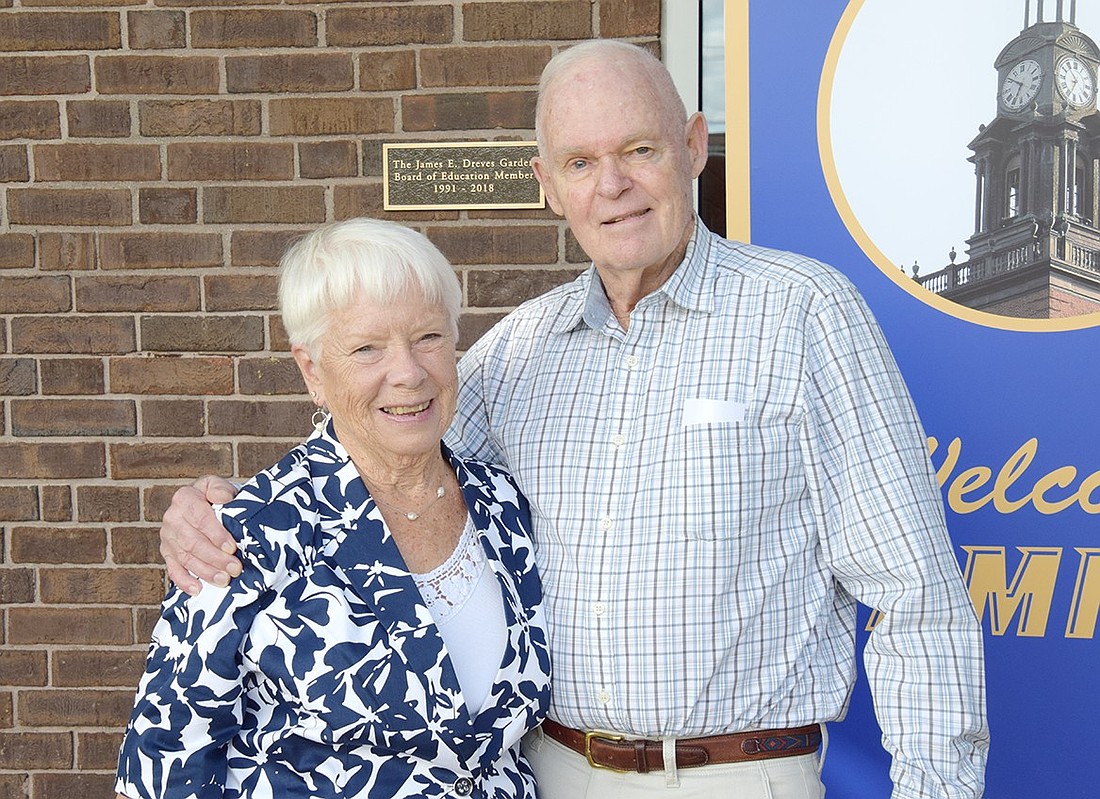 James Dreves, who served on the Port Chester Board of Education for 27 years, poses for a photo with his wife Kathy at the administration building on Tuesday, Aug. 20. The district had just hosted a small celebration honoring his legacy by naming a garden after him.