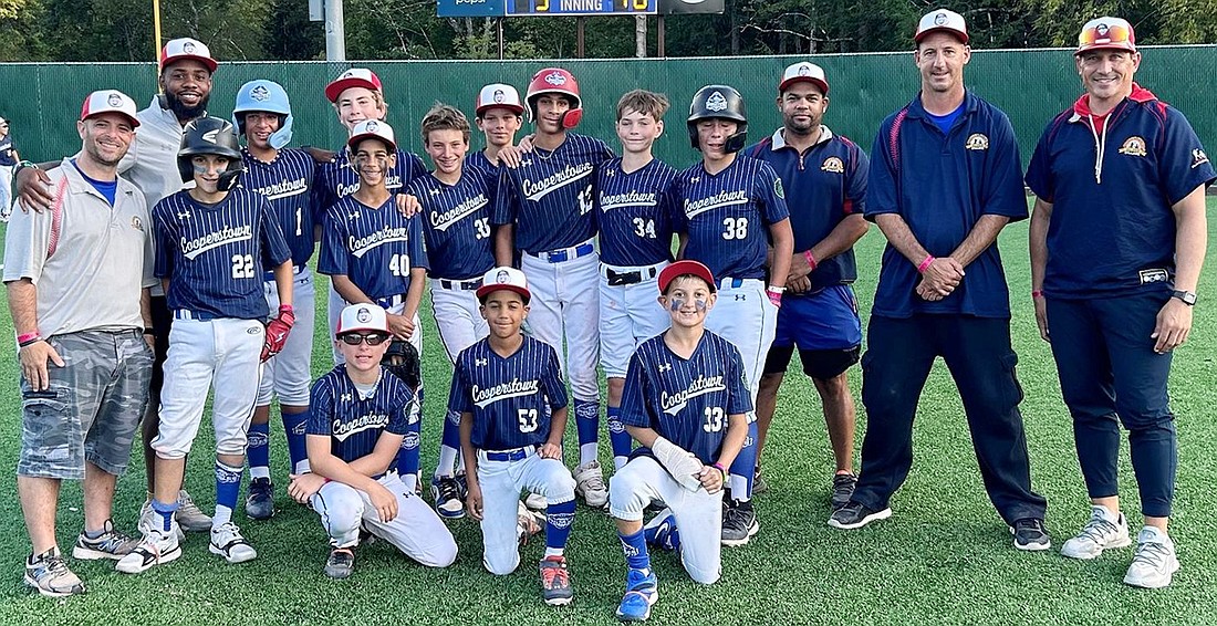 The 12U Pirates pose for a photo during their week playing baseball in Cooperstown. Standing, from left: Coach George Varbero, Coach Terell Iconic, Braden Squillace, Aaron Malhotra, Ross Kantor, Fabio Garcia, Michael Vernace, Jack Louis, Alex Malhotra, Spencer MacFarlane, Joey Bologna, Coach Fabio Garcia, Coach Steve Rytelewski, Coach John Louis. Kneeling, from left: Tyler Varbero, Juan Garcia, Louis Rytelewski.