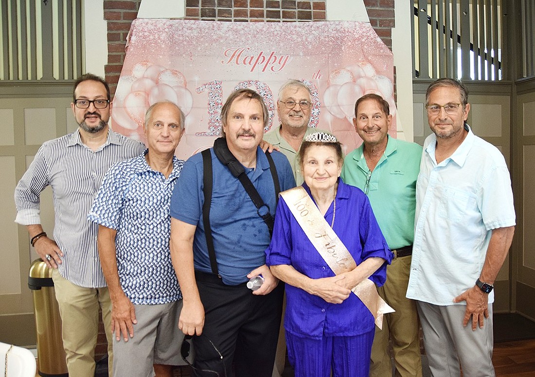 Catherine Morlino poses with her sons Keith (left), Bruce, Brian, Ronnie, Bobby and Sal during her 100th birthday celebration at the Crawford Mansion Community Center on Aug. 17. A lifelong Port Chester local, the Tower Hill Drive resident celebrated her centennial on Monday, Aug. 26.