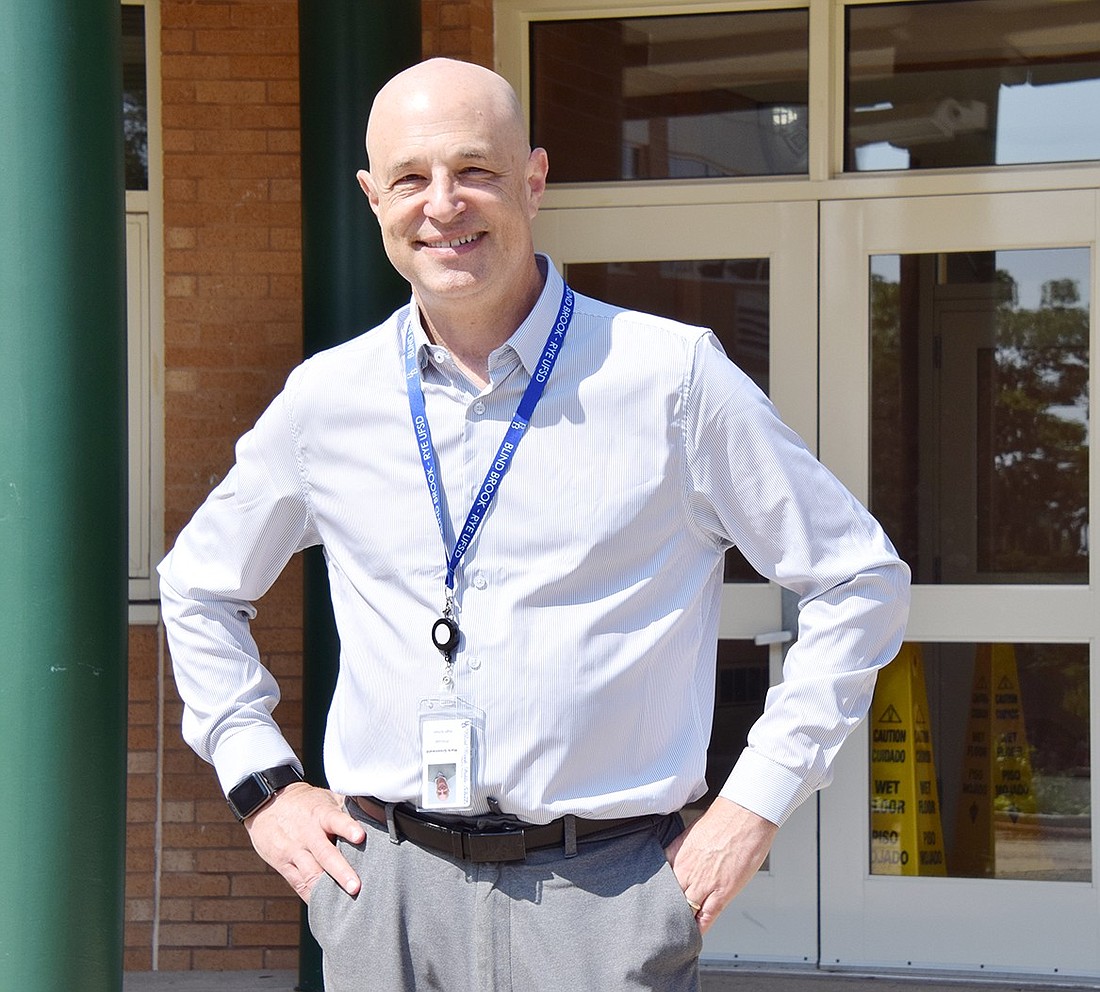 Mark Greenwald, the new principal of Blind Brook High School, poses for a photo in front of the building on Monday, Aug. 26, after discussing his new role in the school district.