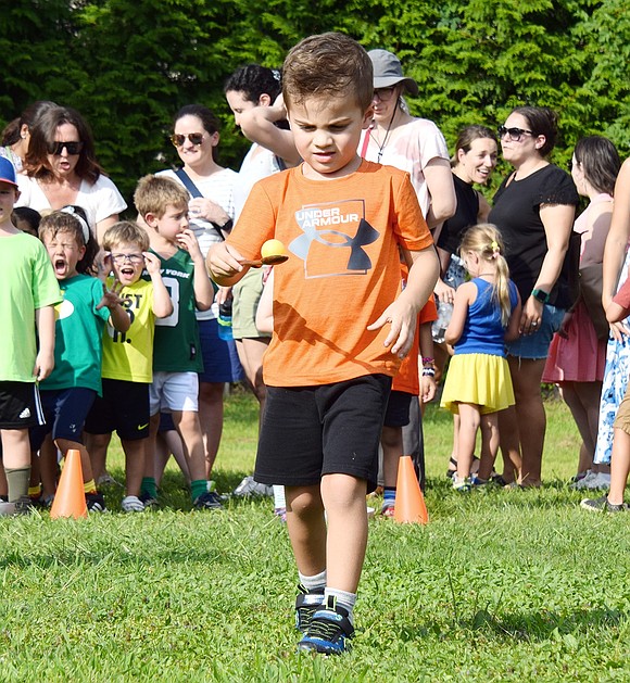 Soon to be a new Blind Brook student in Gerri Fisher’s class, Matthew Dancona’s eye is on the prize as he zips through an egg race at the PTA’s annual pre-school year Kindergarten Social on Wednesday, Aug. 28.