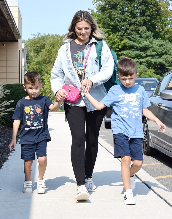 Erik Nikci (left), a 4-year-old Country Ridge Drive resident, joins his mom Eneida in picking up his 5-year-old brother Noah from his second day as a kindergartner at Ridge Street Elementary School on Wednesday, Sept. 4. Hundreds of students in the Blind Brook School District started the 2024-25 school year this week.