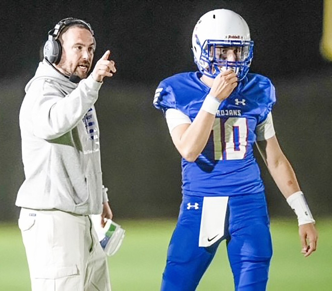 Coach Darren Perillo with Jake Minick, quarterback of the last Blind Brook Trojans football team.