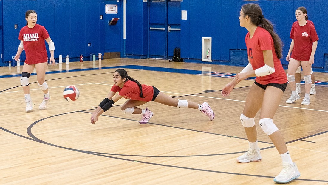 Sophomore Sasha Jhangimal dives for the ball during a varsity volleyball practice session Monday, Sept. 3 in the Blind Brook High School gym.