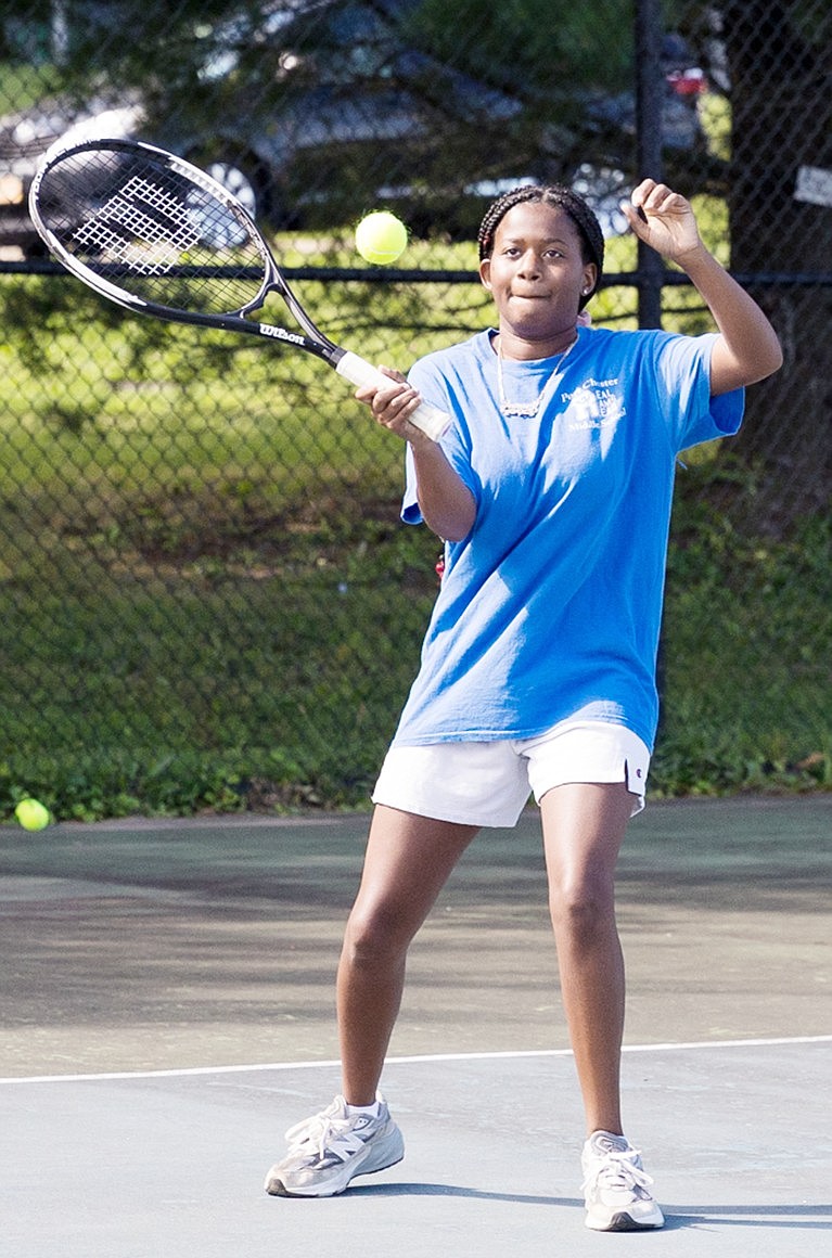 New Port Chester girls’ tennis coach Santos Avila is encouraged by the stepped up play of Journey Adamson.