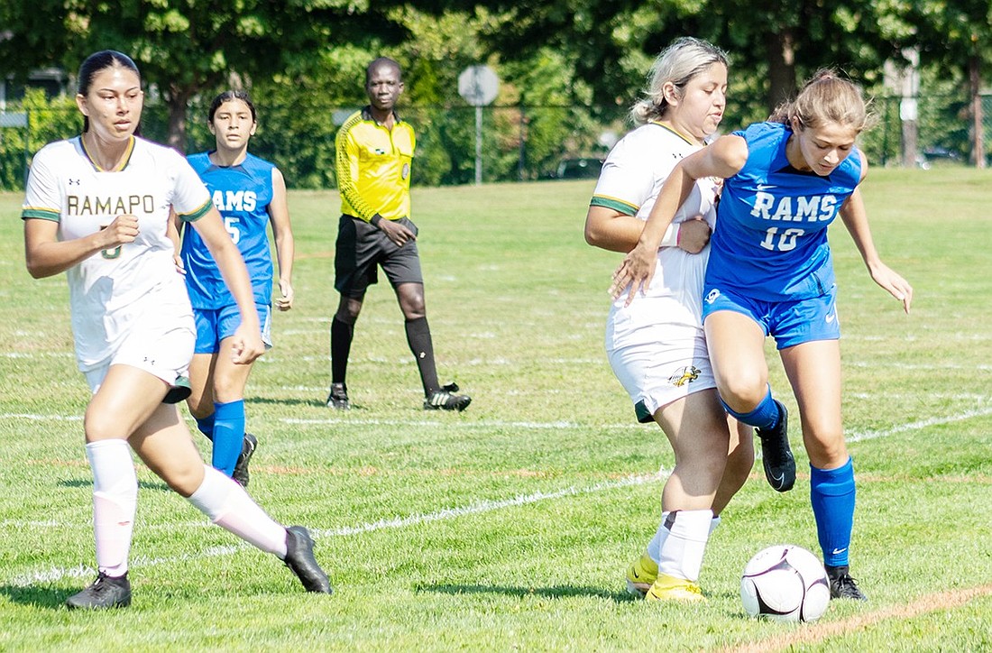 Port Chester Lady Ram sophomore Gianna Rende (#10) pushes a Ramapo defender out of the way during a home soccer game on Saturday, Sept. 14. The Lady Rams defeated the Gryphons 8-0.