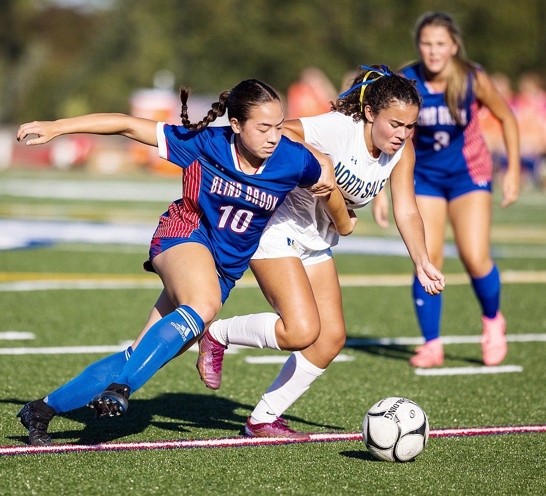 Junior captain Kayleigh Curran, an attacking midfielder, cuts around a North Salem defender in Blind Brook’s Tuesday, Sept. 10 home game. The Trojans defeated the Vikings 2-0.