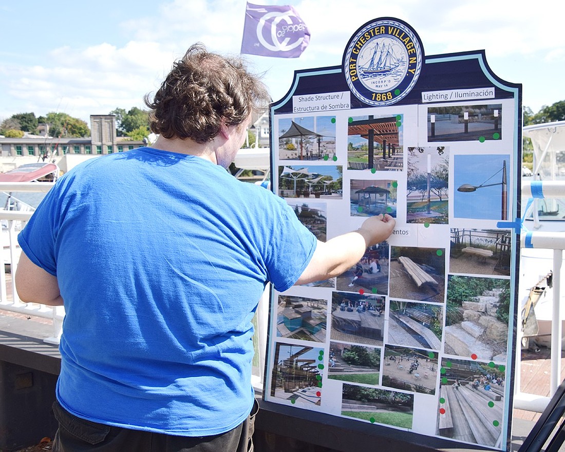 Webster Place resident Brian Sullivan selects a gazebo as something he’d like to see at the waterfront during a public survey hosted by the Port Chester Planning Department on Friday, Sept. 20. As the bulkhead replacement project nears its conclusion, the Village is looking for input to gauge what the community would like the marina to look like and what the space could be used for.