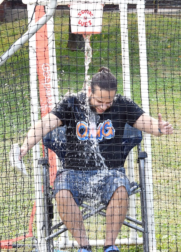 “I’m not coming to the next department meeting,” Port Chester High School English teacher Rich Laconi yells after his co-worker Gregory Guarino dusted off his pitching skills to dump a bucket of water on his head.