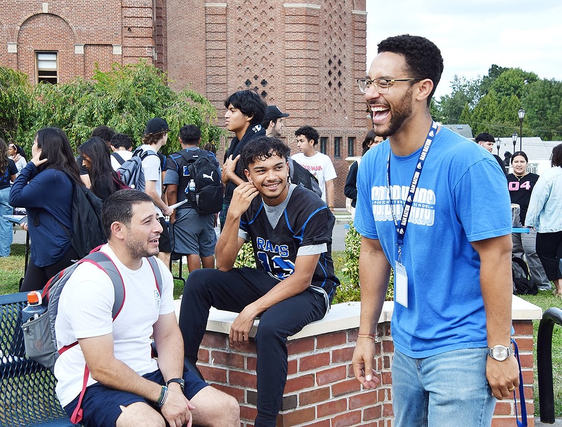 Physical Education teacher John Puedo (left) cracks jokes with one of his students, junior Emanuel Diaz, and Social Studies teacher Jeffrey Kravitz.