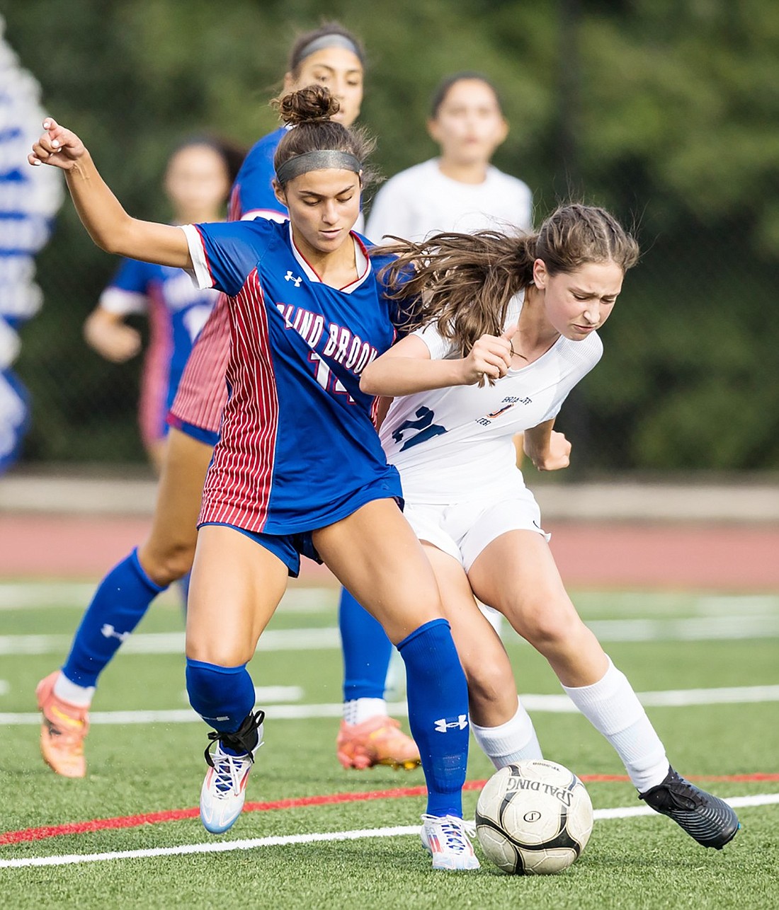 Freshman winger Gabby Cavallo plays around a Briarcliff defender in a home game on Friday, Sept. 20. Blind Brook lost that contest 7-5.