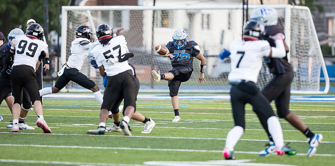 Port Chester kicker Luis Granados (#72) gets kickoff under heavy pressure from the charging Long Island Lutheran (Luhi) line during the Rams’ home loss under Friday (9/20) night lights.