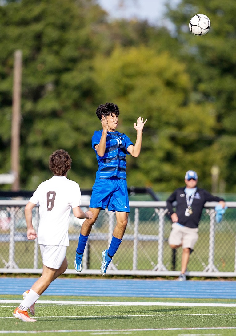 Senior midfield Marcos Barajas heads the ball in the Rams’ Tuesday, Sept. 17 game against Mt. Vernon. Port Chester won that contest 5-0.