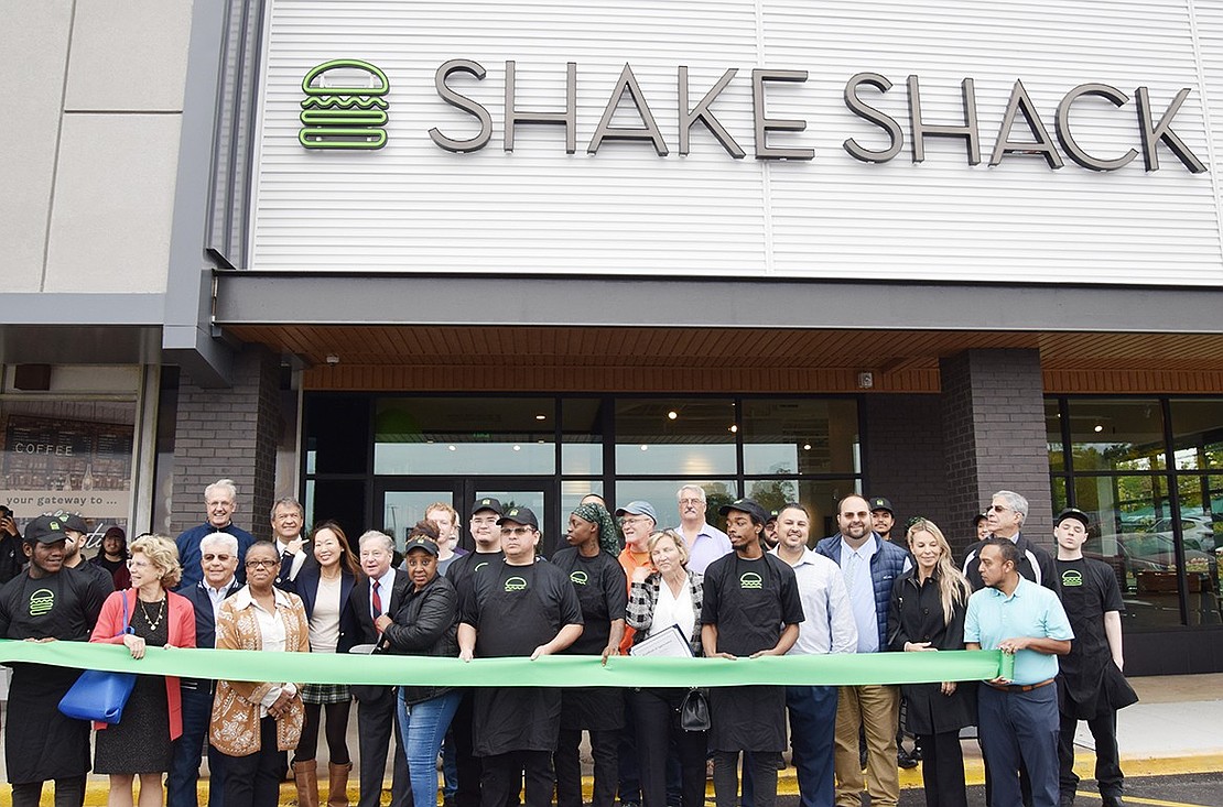 A big group of local elected officials, Port Chester Village Manager Stuart Rabin, Port Chester-Rye Brook-Rye Town Chamber of Commerce members, Bruce Jackson from Feeding Westchester and Shake Shack personnel gather for the ribbon cutting to open the long-awaited restaurant serving fancy burgers, fries, milkshakes and more in the Gateway Shopping Center on Wednesday, Sept. 25. This Port Chester location was first contemplated four years ago, said Emma Greene, Shake Shack’s area director for Westchester. “I’m very confident this is the right time.”