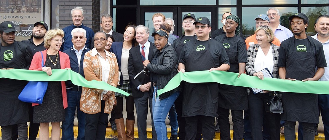 Keiona Cherry, general manager of Shake Shack’s Port Chester location, cuts the ribbon. All day long on opening day, the company donated $1 from every sandwich sold to Feeding Westchester as part of their mission of standing for something good by partnering with local charities. They also distributed Shake Shack tote bags to the first 100 customers.