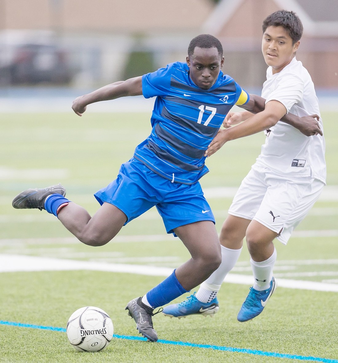 Senior defender Wali Imafidon tries to move past a White Plains player during the Port Chester Rams’ Friday, Sept. 27 home loss to White Plains.